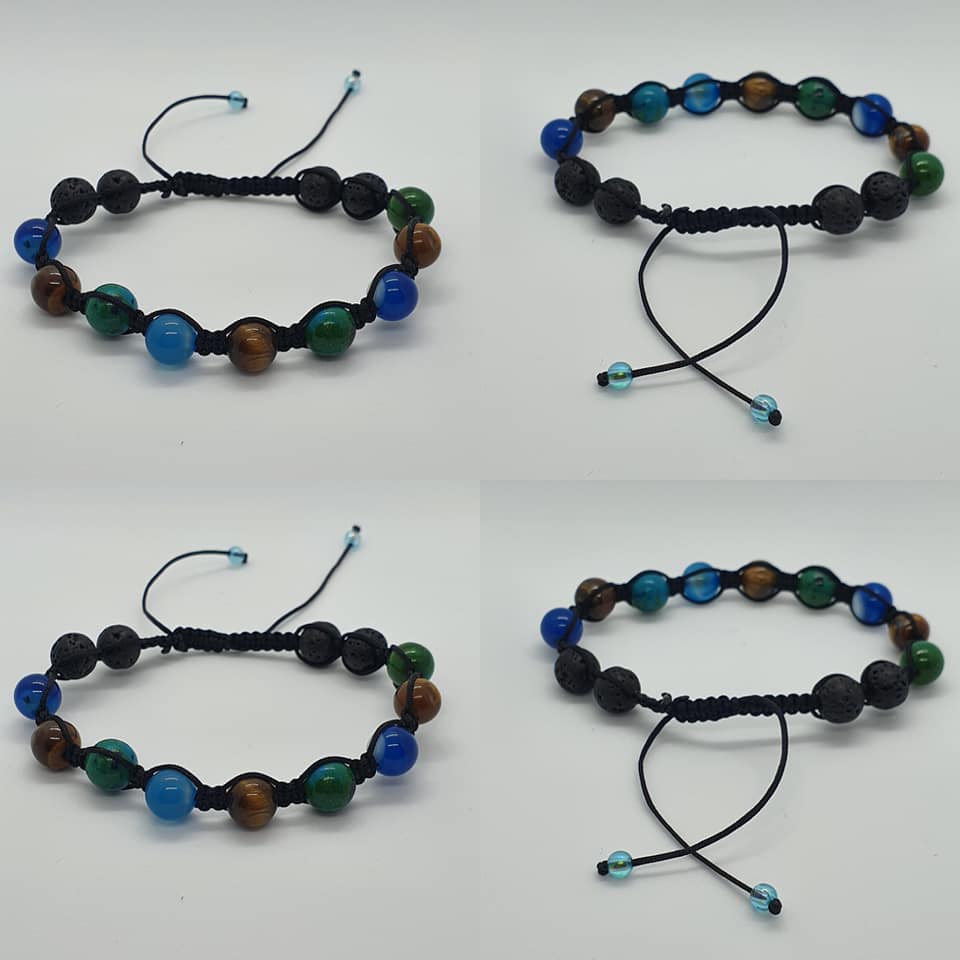 Four adjustable beaded bracelets arranged in a 2x2 grid on a white background. Each bracelet features black cord, black lava beads, blue agate beads, and Goldstone and green agate beads.