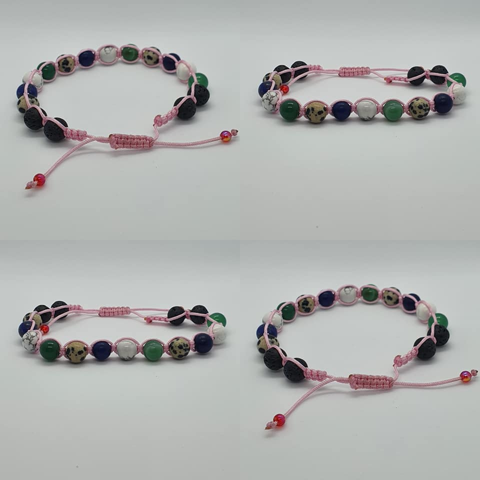 Four handmade beaded bracelets arranged in a 2x2 grid on a light gray background. Each bracelet features pink cord, round beads in green aventurine, Lapis Lazuli, white Howlite, Dalmation Jasper, Lava stone and a small red bead accent at the sliding knot.